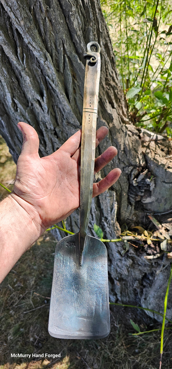 Forged and filed spatula w/ line detail and vine tail